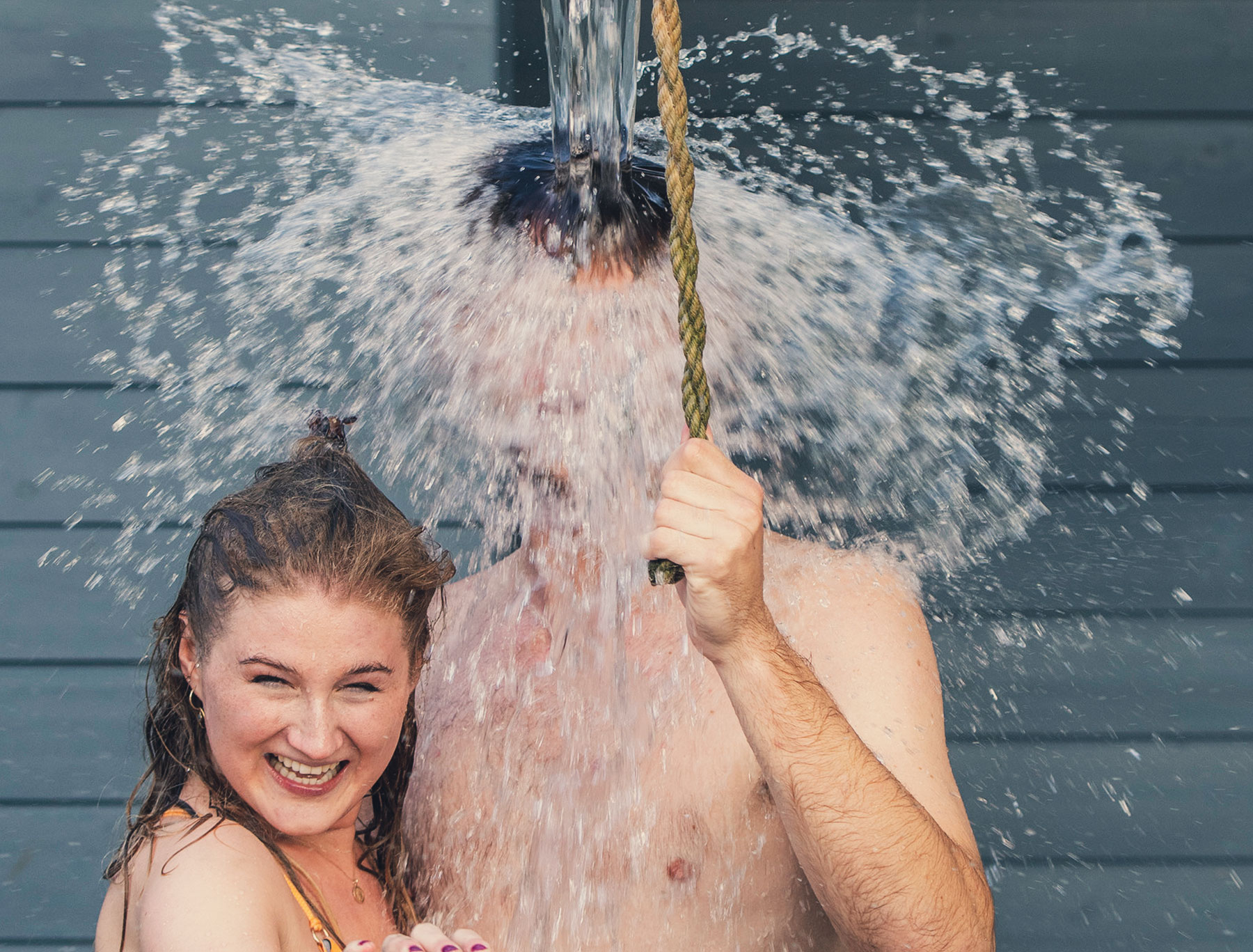 Couple taking an outdoor shower at Taymouth Marina